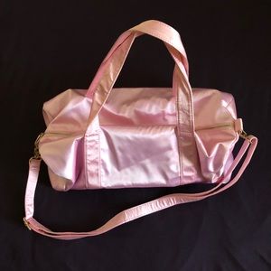 Pink satin duffle bag.